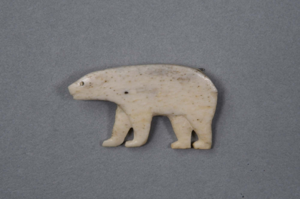 Image: Bone polar bear pin with carved mouth and ear