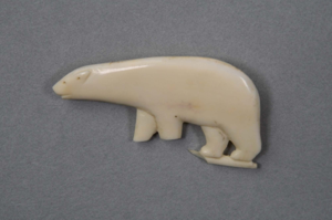 Image of Ivory polar bear pin with carved detail standing on iceberg - broken bottom left