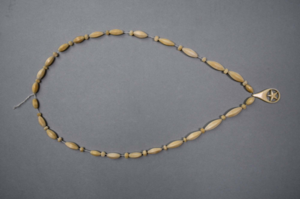 Image: Necklace with oblong-shaped beads, small star-shaped beads and 1 large tear-drop