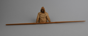 Image of Wooden figure (torso) in anorak, with 20" long paddle, for kayak model