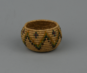 Image: Coiled grass basket with multi-colored design