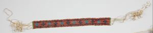 Image: Labrador bead band with orange, navy, blue, red, green, diamond geometric patterns (as on bead loom)