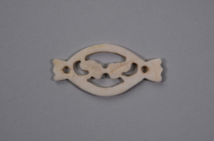 Image: Small ivory piece with two leaves in center