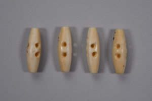 Image of Four ivory buttons with 2 holes