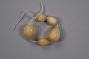 Image: Five tear drop shaped ivory beads
