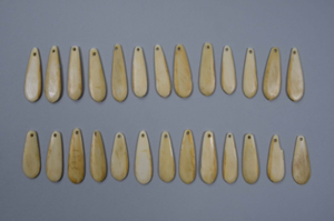 Image: Ivory pendants - long, flat, oval - with hole at narrow end