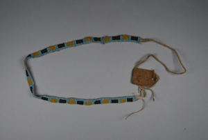 Image of Blue beaded band with alternating yellow and black squares hair wrapper, [shetshipatuan]