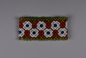 Image of Beaded child's cuff with circle pattern in orange, green, white, blue