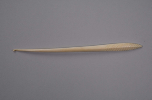 Image of Crochet hook with 19 V carved into wide end