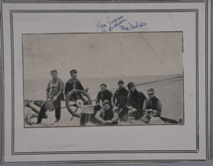 Image of Schooner Bowdoin crew at wheel