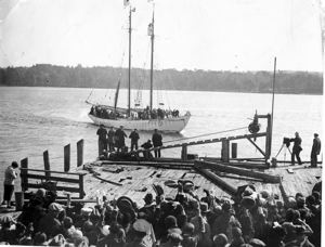 Image of Arrival of Schooner Bowdoin, crowd on dock, cheering