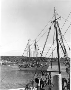 Image of Schooner Bowdoin, dressed, with many guests aboard