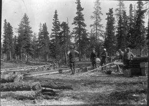 Image: Men laying out MacMillan Scientific Station