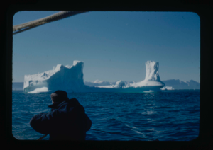 Image: Icebergs. Crew man in foreground (2 copies)