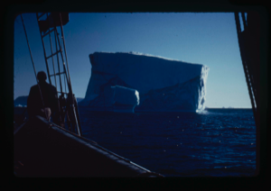 Image of Iceberg with shadow, seen through rigging. Crew man on deck (2 copies)