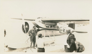 Image of Four men by Donald MacMillan, aerial expedition seaplane, the Viking