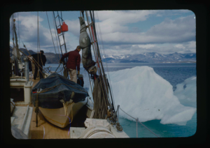 Image: The Bowdoin maneuvering beside iceberg