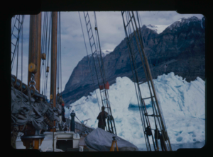 Image of The Bowdoin against iceberg which is against mountain
