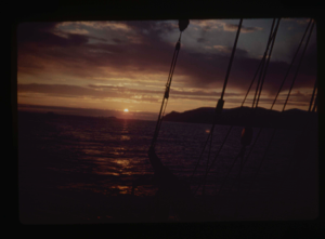 Image of Midnight sun setting, through rigging