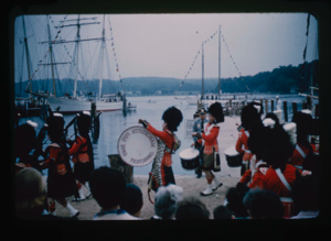 Image of Manchester, Connecticut, Pipe Band marching before the Bowdoin's berth at Mystic