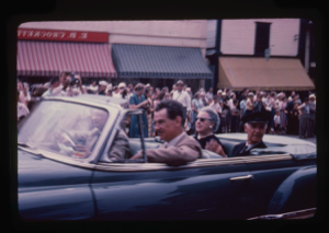 Image: Open car with Donald MacMillan, Frances and Lowell Thomas in parade