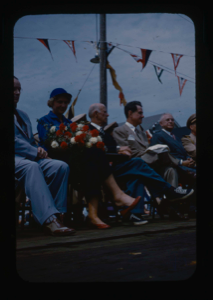Image of Speakers' Platform on Departure Day. Deated include: Lowell Thomas, Donald and M