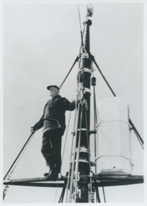 Image of MacMillan by ice bucket of schooner Bowdoin