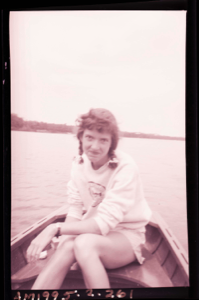 Image of Young woman in rowboat wearing Oberlin College shirt