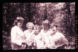 Image of Five young women with faces painted, one wears an Oberlin t-shirt