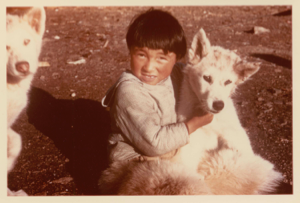 Image of Eskimo [Inuk] boy with two dogs