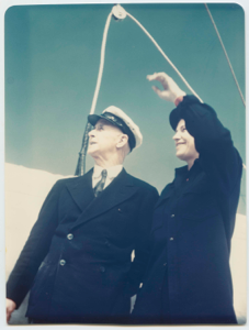 Image: Donald and Miriam MacMillan standing on the Schooner Bowdoin