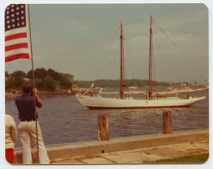 Image of Man photographing Schooner Bowdoin arriving at Camden Yacht Club