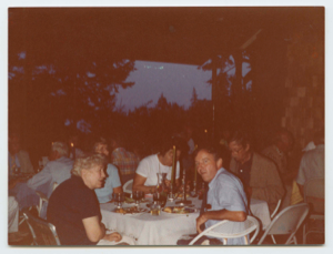 Image of Dinner party on a patio Miriam MacMillan in foreground