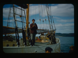 Image: Crew man on deck with movie camera