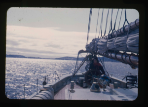 Image of View across Bowdoin's stern. Miriam MacMillan at wheel
