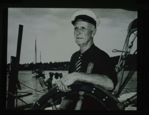 Image of Donald MacMillan sitting at the wheel