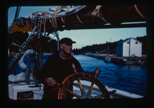 Image of Donald MacMillan at wheel, in St. Peter's Locks(2 copies)