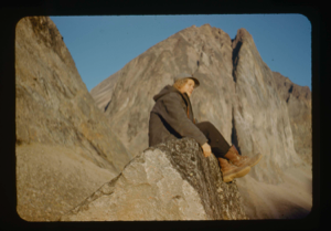 Image of Miriam MacMillan sitting on a rock