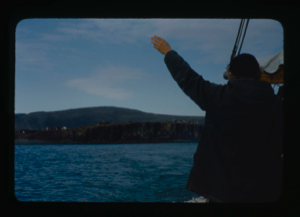 Image: Miriam MacMillan waving goodbye to Eskimos [Inuit] on a bluff (2 copies)
