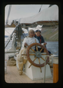 Image of Miriam MacMillan and Polar Eskimo [Inughuit] man at wheel