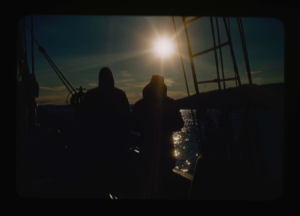 Image of ? and? (Donald MacMillan?) on watch in midnight sun