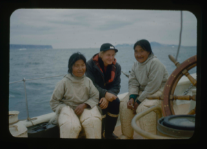 Image of Two Inuit women and Miriam MacMillan by wheel