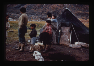 Image of Eskimo [Inuit] family beside their tent