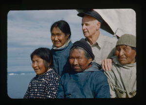 Image of Donald MacMillan, Ootaq, Harrigan [Inukitooq] and two Eskimo [Inughuit] women from North Pole Expedition