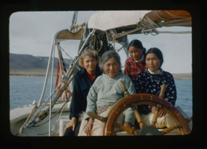 Image of Three Polar Eskimo [Inughuit] women and Miriam MacMillan at wheel