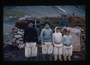 Image: Ahnowka and boys by their sod/stone home (2 copies)