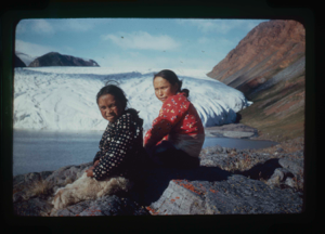Image of Young woman and boy seated by Brother John's Glacier (2 copies)