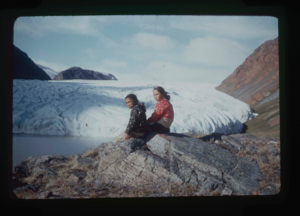 Image of Young woman and boy seated by Brother John's Glacier (2 copies)