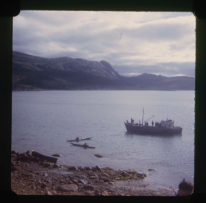 Image of Fishing boat and two kayakers