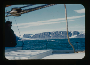 Image of Donald MacMillan aboard, looking at glaciers